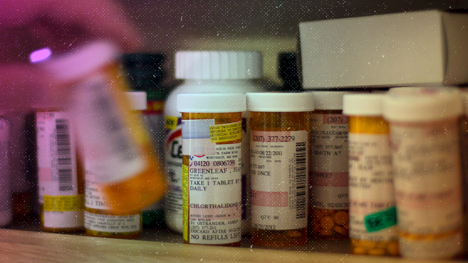 A patient returns medication to a cabinet at her home. (AP Photo/Robert F. Bukaty)