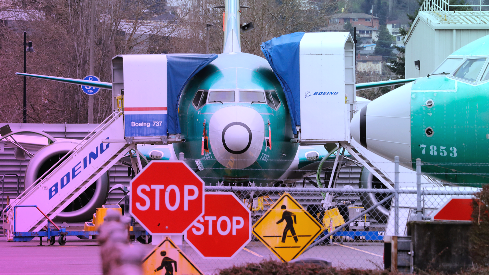 Boeing 737 MAX jets sit parked at a Boeing facility in Renton, WA.