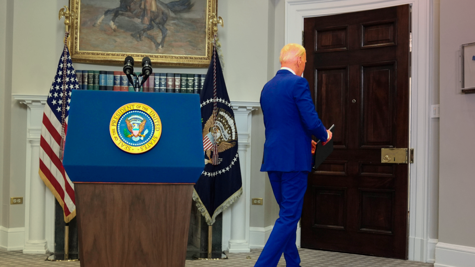 President Joe Biden walking away from the podium after delivering remarks in the White House.