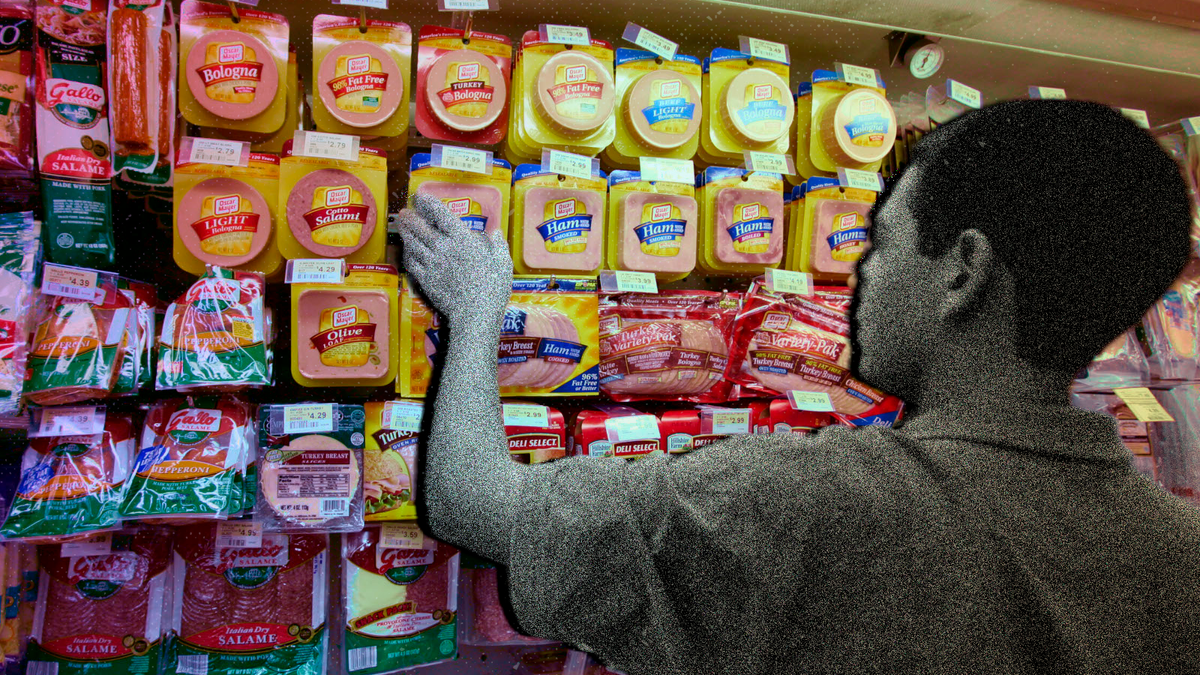A customer picks out luncheon meat at a grocery store.