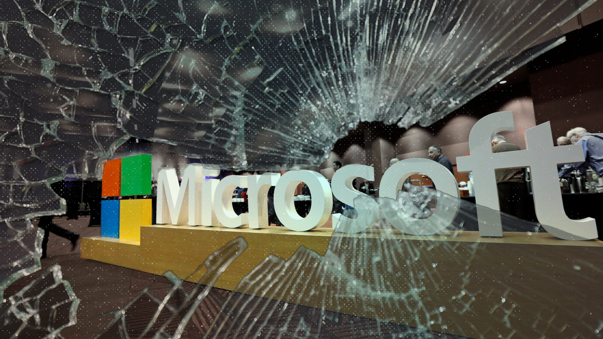 A photo of a large Microsoft sign is overlaid with a photo of broken glass.