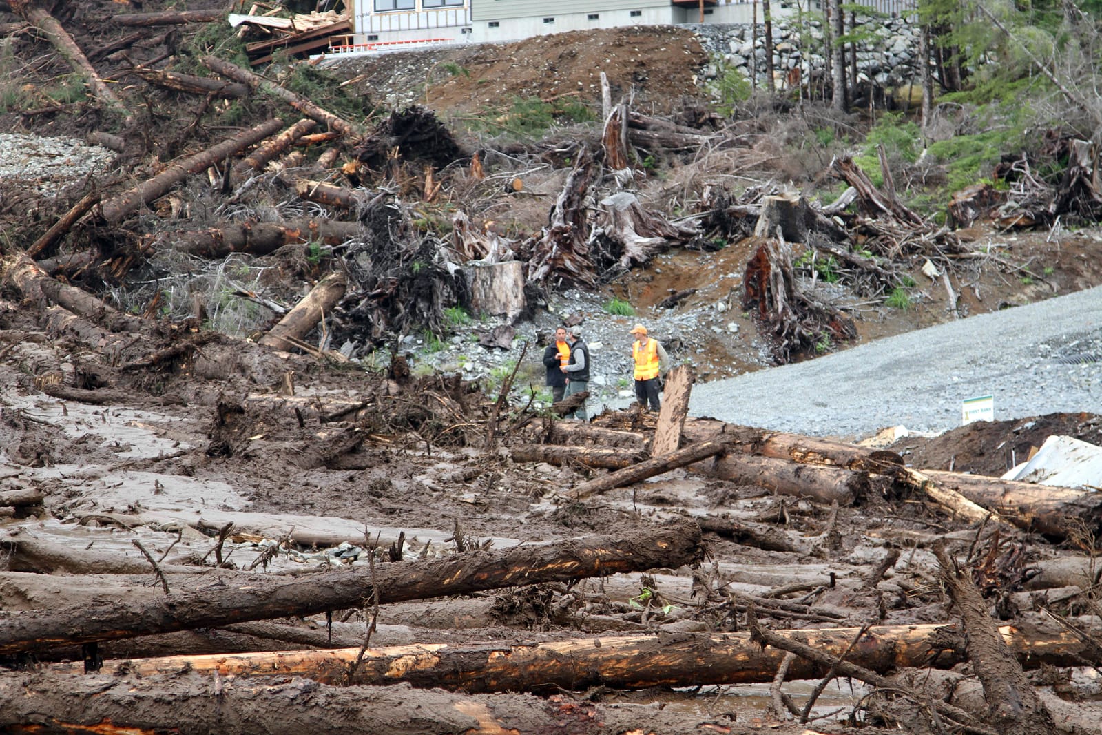 Emergency responders survey landslide damage in Sitka, Alaska, in 2015. 