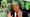 In a composite image, famous billionaire donors are seen behind a smiling Donald Trump.